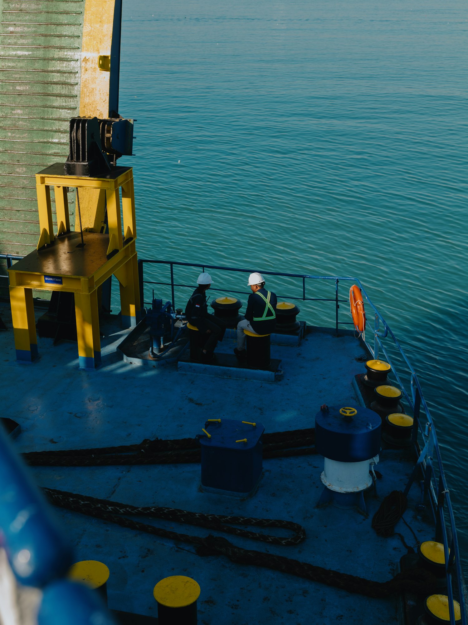 Crew on the aft deck of a vessel at sea